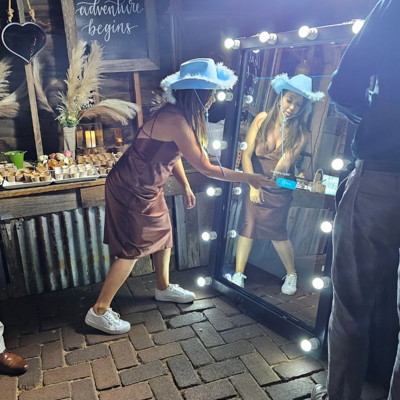 firecracker photobooths mirror booth being used at a wedding